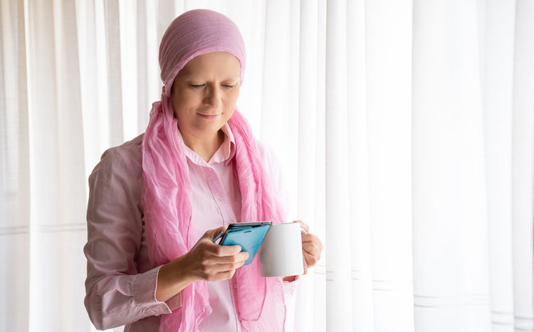 Woman wearing head scarf looking at phone